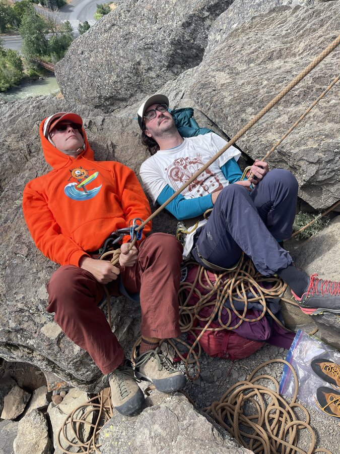 Foiling Freaks at the crag. Rocking an orange hoodie. merch photo