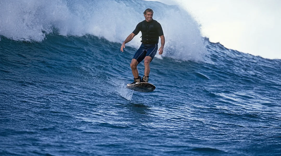 Big Wave Foiling Live Action Image - (AI was used to enhance the original degraded film image for clarity)